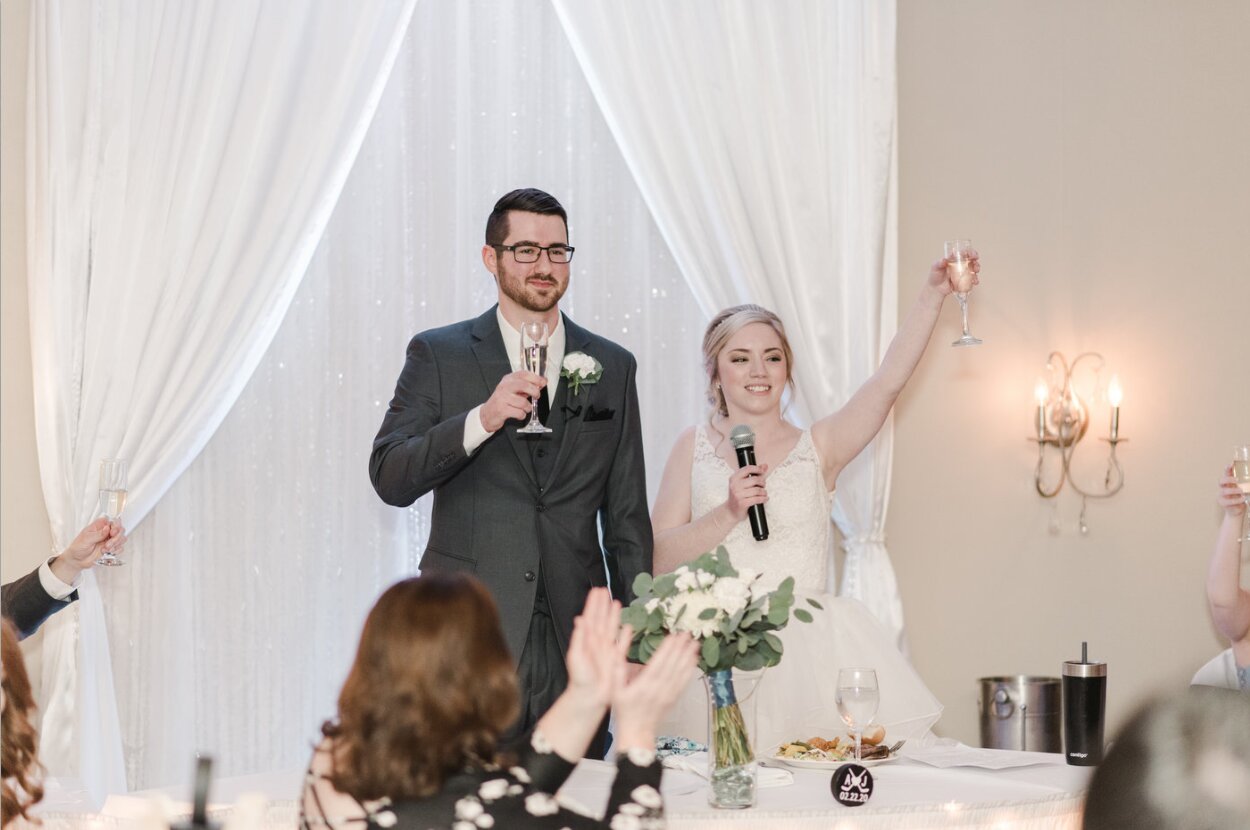 Newlyweds enjoying their wedding cake