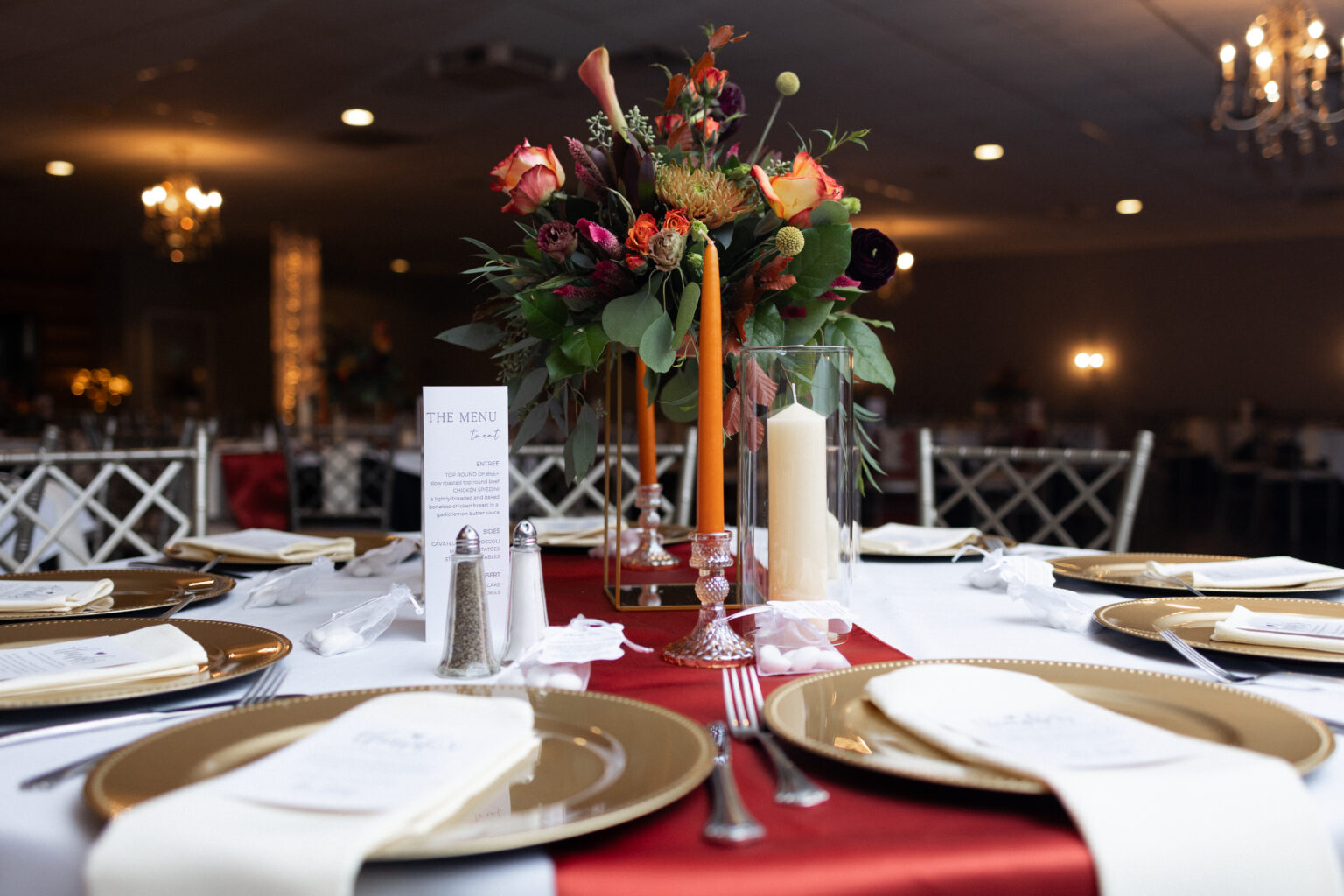 Candlelit place settings with gold accents