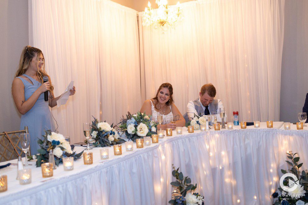Maid of honor toasting the newlyweds at the head table